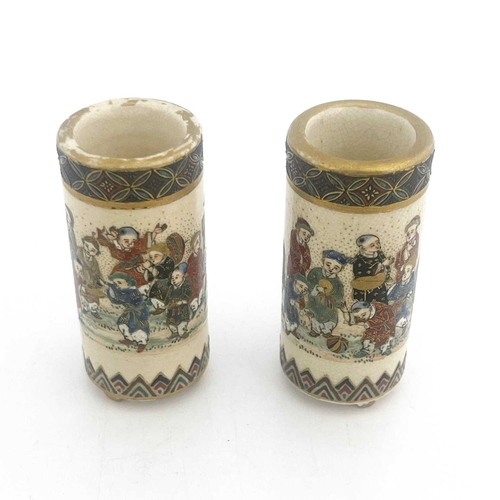 408 - A pair of Japanese Satsuma miniature vases, of cylindrical brush pot form, painted in the round with... 