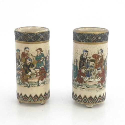 408 - A pair of Japanese Satsuma miniature vases, of cylindrical brush pot form, painted in the round with... 