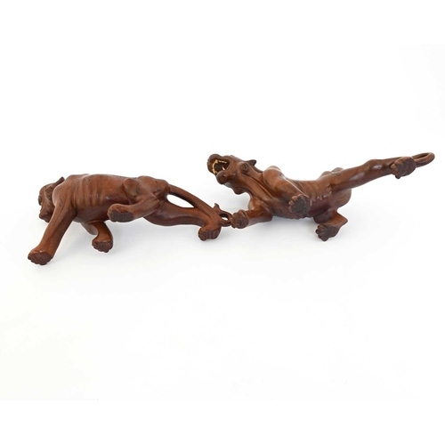 440 - A pair of Japanese carved wood figures of tigers, Meiji, modelled with bone teeth and bead eyes, pai... 