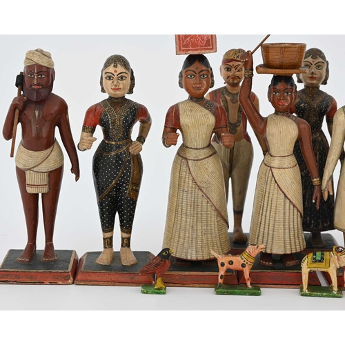 442 - A group of Indian wooden figures, late 19th Century or early 20th Century, each carved and realistic... 