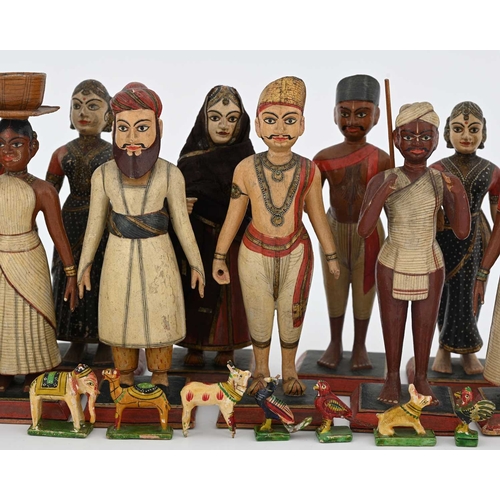 442 - A group of Indian wooden figures, late 19th Century or early 20th Century, each carved and realistic... 