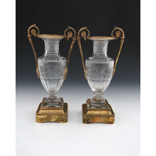 469 - A pair of Baccarat cut glass and ormolu mounted twin handled vases, of Neoclassical Empire form, 20t... 