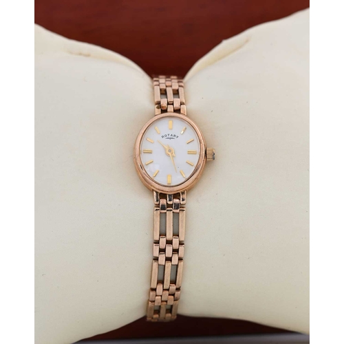 48 - Rotary, a ladies 9 carat gold wristwatch with gold bracelet strap, oval white enamelled dial, in ori... 