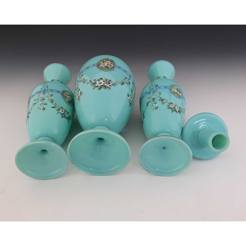 480 - A garniture of three Bohemian enamelled opaline glass vases, each of footed form in turquoise, paint... 