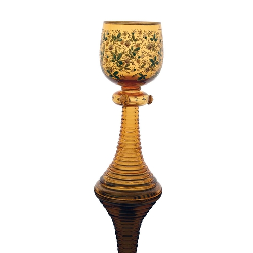 482 - A Bohemian enamelled and gilt glass roemer, probably Moser circa 1900, painted with daisies, the hol... 