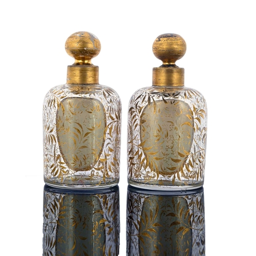 483 - A pair of Bohemian glass portrait bottles, with stoppers, shouldered cylindrical form, each with a p... 