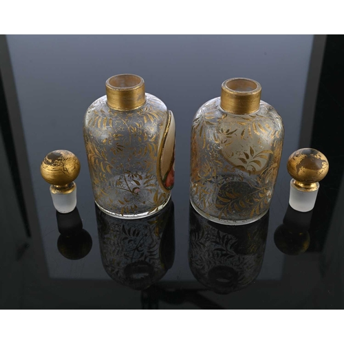 483 - A pair of Bohemian glass portrait bottles, with stoppers, shouldered cylindrical form, each with a p... 