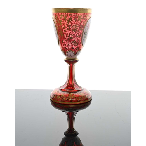 484 - A Bohemian floral plaque red glass goblet vase, 19th century, pedestal chalice form, two opaque oval... 