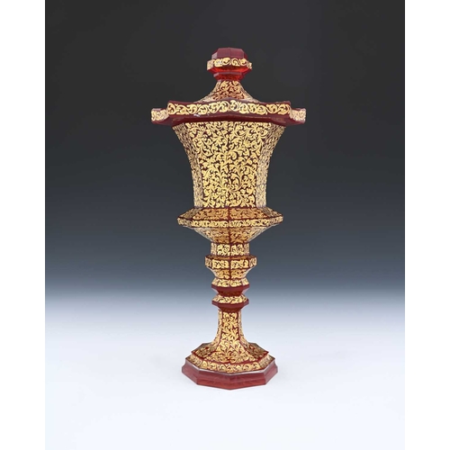 491 - A Bohemian raised gilt and red washed glass chalice and cover, octagonal section slice cut and knopp... 