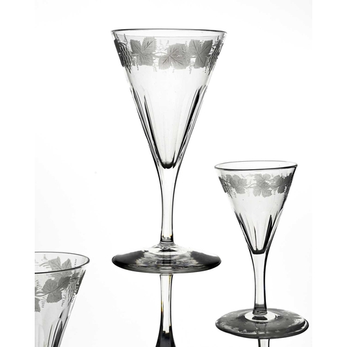 492 - James Powell and Sons, Whitefriars, a set of five etched wine and drinking glasses, circa 1855, the ... 