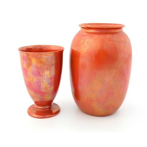 581 - Ruskin Pottery, two Orange Lustre vases, circa 1915, including a footed beaker vase and a shouldered... 