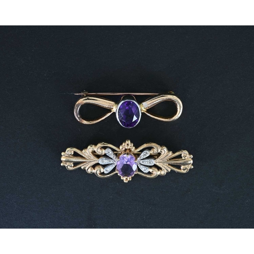 6 - Two gold and amethyst brooches, including a 9 carat foliate bar brooch with diamond chips and centra... 