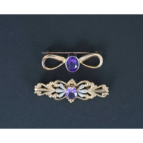 6 - Two gold and amethyst brooches, including a 9 carat foliate bar brooch with diamond chips and centra... 