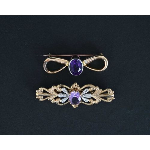 6 - Two gold and amethyst brooches, including a 9 carat foliate bar brooch with diamond chips and centra... 