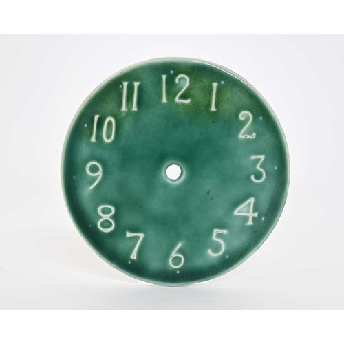 602 - Ruskin Pottery, a Souffle glazed clock face, relief moulded with Arabic numerals, green glaze, unmar... 