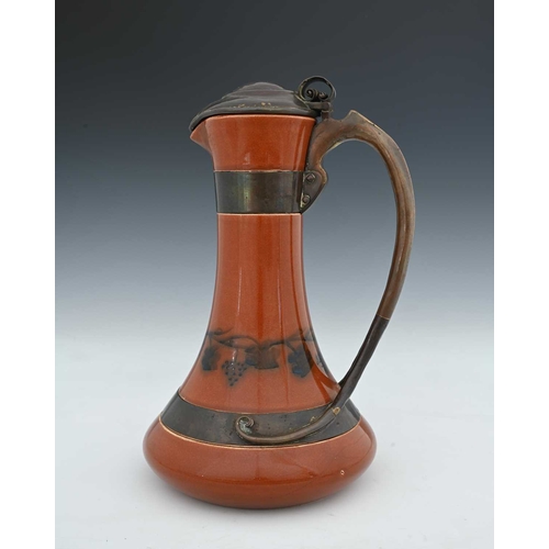 603 - Jesson, Birkett and Co for Ruskin Pottery, a copper mounted claret jug, circa 1905, flared bulbous f... 