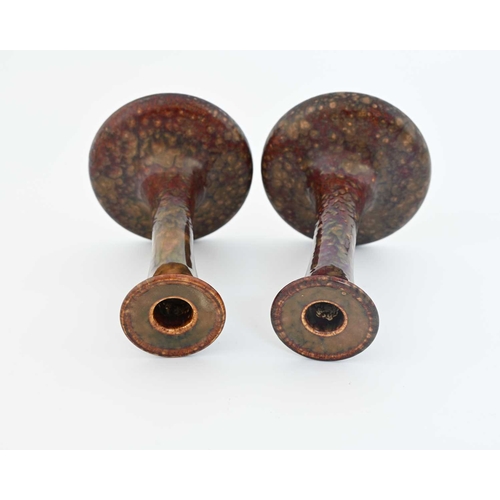 606 - Ruskin Pottery, a pair of candlesticks, 1924, sweeping trumpet form, mottled semi lustre souffle typ... 