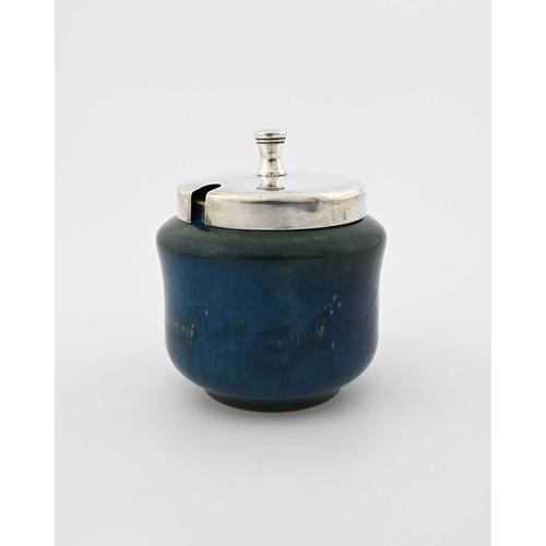 607 - Ruskin Pottery, a Souffle glazed pot, with a silver cover, circa 1914, waisted drum form with blue g... 