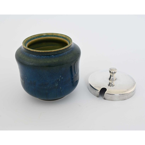 607 - Ruskin Pottery, a Souffle glazed pot, with a silver cover, circa 1914, waisted drum form with blue g... 