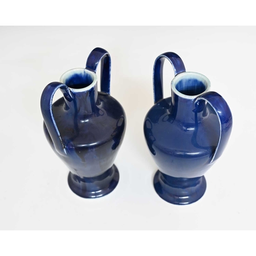 616 - Ruskin Pottery, a pair of Souffle Glaze twin handled vases, circa 1901, shouldered inverse baluster ... 