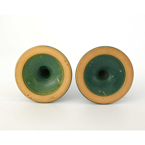 618 - Ruskin Pottery, a pair of Souffle glazed candlesticks, circa 1903, trumpet form with poppy head scon... 