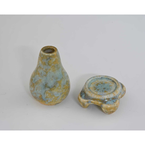 622 - Ruskin Pottery, a miniature glazed vase and stand, circa 1930, gourd bottle form on a foour bracket ... 