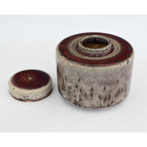 630 - Ruskin Pottery, a High Fired inkwell, 1915, cylindrical drum form with disc lid, the main body with ... 