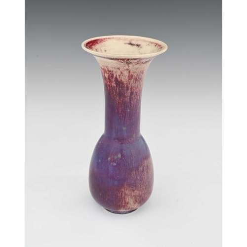 637 - Ruskin Pottery, a High Fired vase, 1925, elongated bulbous bottle form with flared trumpet neck, pur... 