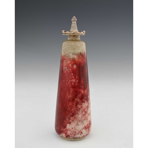 638 - Ruskin Pottery, a High Fired scent bottle and stopper, 1927, conical form with screw top denticulate... 