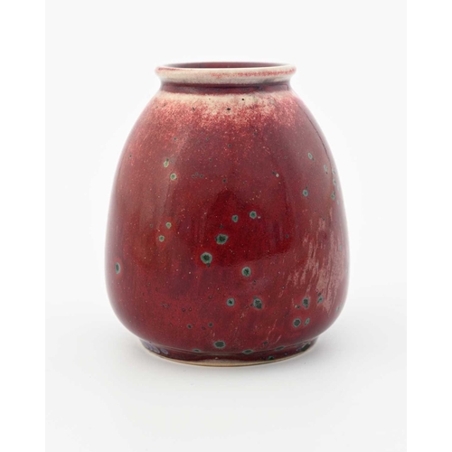 642 - Ruskin Pottery, a small High Fired vase, 1933, ovoid conical form, green oxide speckled sang de boeu... 