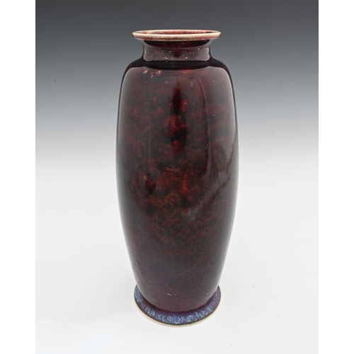 643 - Ruskin Pottery, a High Fired vase, 1910, shouldered barrel form, deep sang de boeuf glaze with blue ... 