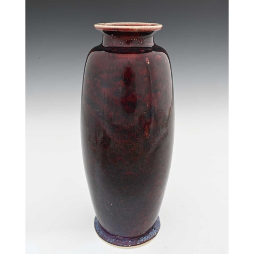 643 - Ruskin Pottery, a High Fired vase, 1910, shouldered barrel form, deep sang de boeuf glaze with blue ... 