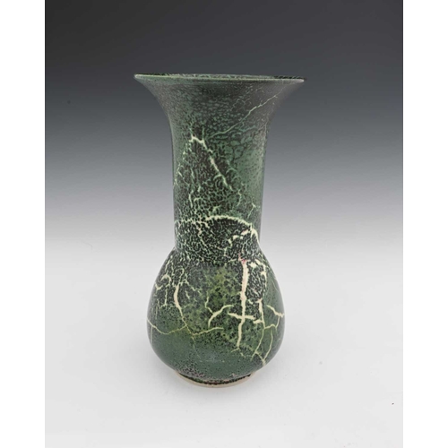 644 - Ruskin Pottery, a High Fired vase, circa 1909, bulbous form with long cylindrical neck and flared ri... 