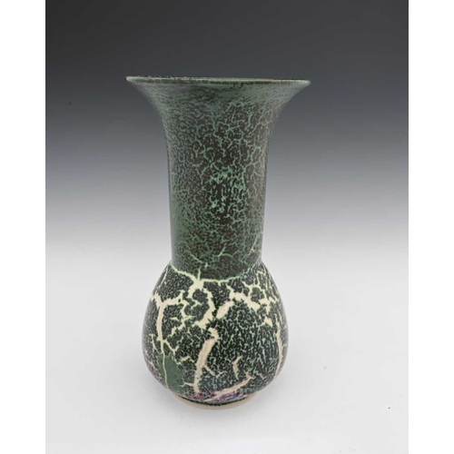 644 - Ruskin Pottery, a High Fired vase, circa 1909, bulbous form with long cylindrical neck and flared ri... 