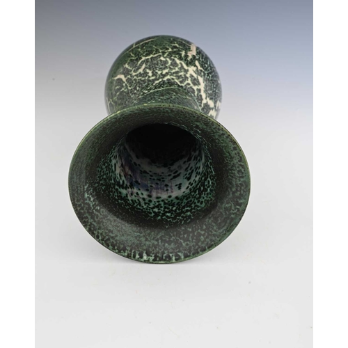 644 - Ruskin Pottery, a High Fired vase, circa 1909, bulbous form with long cylindrical neck and flared ri... 