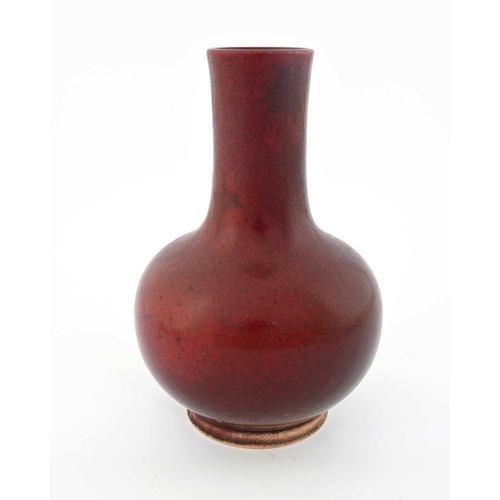 645 - Ruskin Pottery, a High Fired vase, 1905, spherical bulbous form with elongated neck, sang de boeuf s... 