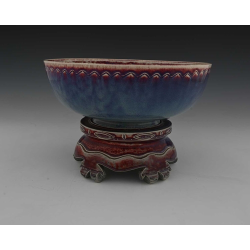 646 - Ruskin Pottery, a High Fired bowl and a stand, 1926 and 1925, the bowl of rounded form with ncised c... 