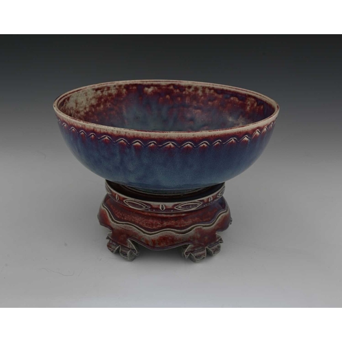 646 - Ruskin Pottery, a High Fired bowl and a stand, 1926 and 1925, the bowl of rounded form with ncised c... 