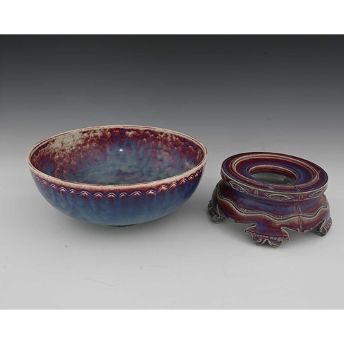 646 - Ruskin Pottery, a High Fired bowl and a stand, 1926 and 1925, the bowl of rounded form with ncised c... 