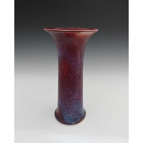 656 - Ruskin Pottery, a High Fired vase, 1933, lily or flared sleeve form, green speckled purple over sang... 