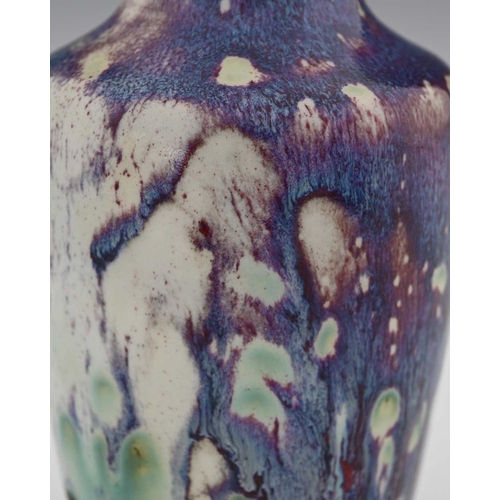 658 - Ruskin Pottery, a High Fired vase, 1920, shouldered form, marbled purple hared fur over white sang d... 