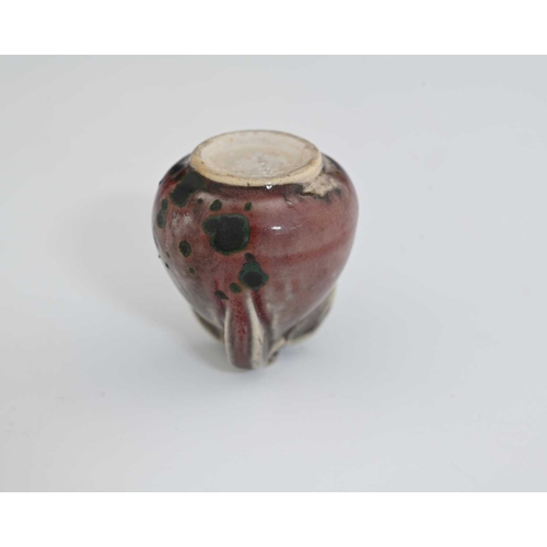 663 - Ruskin Pottery, a miniature High Fired vase, circa 1920s, conical form with three buttress ribs to t... 