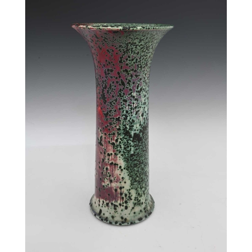 664 - Ruskin Pottery, a High Fired vase, 1905, lily or flared sleeve form, green oxide speckled over sang ... 