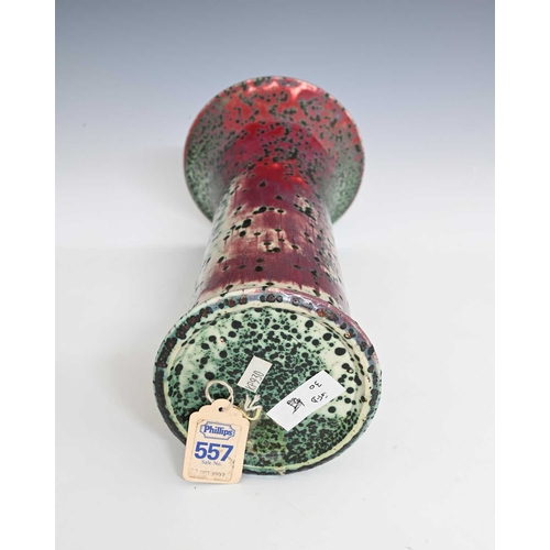 664 - Ruskin Pottery, a High Fired vase, 1905, lily or flared sleeve form, green oxide speckled over sang ... 