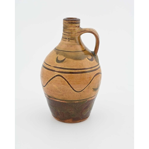 665 - Michael Cardew for Winchcombe, a studio pottery flagon, early 20th century, shouldered form, slip gl... 