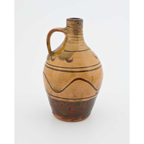 665 - Michael Cardew for Winchcombe, a studio pottery flagon, early 20th century, shouldered form, slip gl... 