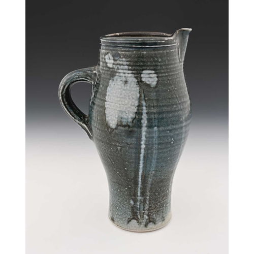 670 - Michael Casson, a studio pottery jug, elongated barrel form, gray blue glazed with abstract painted ... 