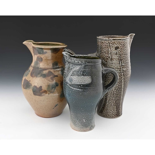 671 - Michael Casson, three studio pottery salt glazed stoneware jugs, obe of slender elongated barrel for... 