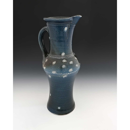 672 - Michael Casson, a large studio salt glazed stoneware jug, shouldered and waisted form, with random p... 