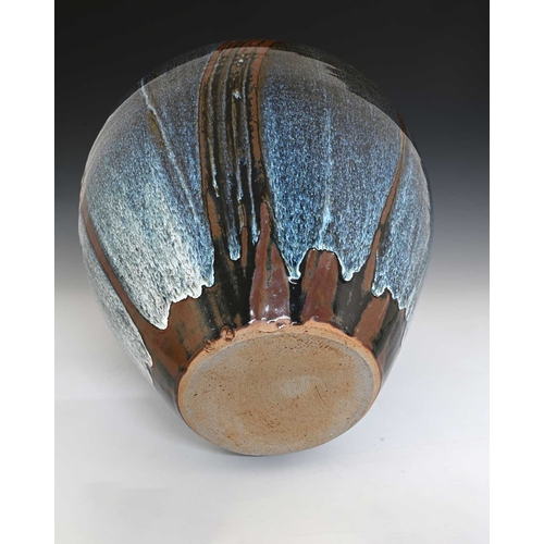 674 - David Frith (British, 1943), a large stoneware bottle vase, decorated with a Chun blue over wax resi... 